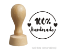 drewniany stempel z napisem 100% handmade